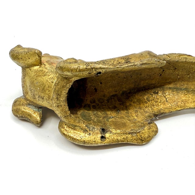 A gorgeous set of three door handles or drawer pulls in bronze with a gilt ormulu finish. They depict a dog’s head. Great...