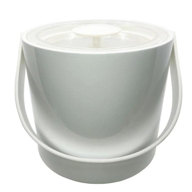 A chic Hollywood Regency ice bucket by Georges Briard. Made from white and transparent acrylic, this ice bucket will look...