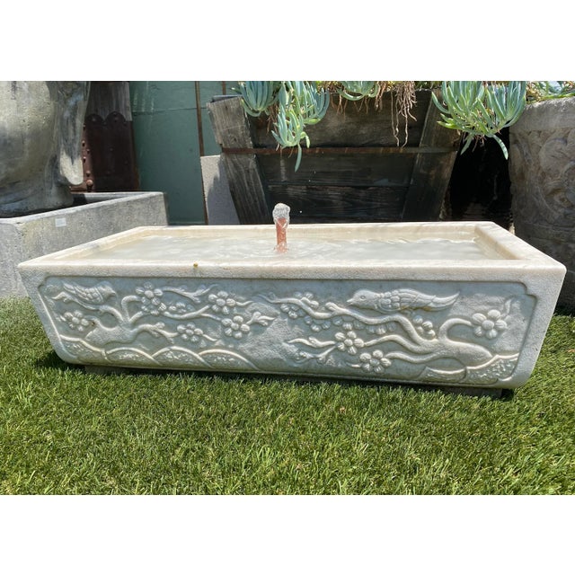 Beautiful hand carved solid white marble tough fountain. Decorative cherry blossom trees and birds on each side. Each will...