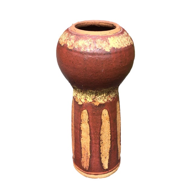 One of a kind vase created in 1971. Singed R. Ahola Interesting shape Rust brown color with yellow glaze accents. Almost...