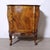 Small mid-20th-century Italian sideboard, bedside table, or bar cabinet in the Baroque style, characterized by carvings...