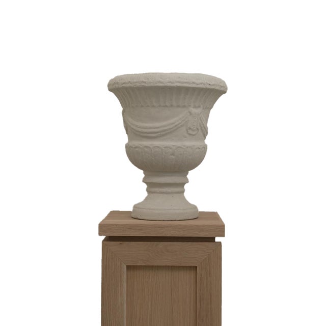 The Vera Vessel brings a sense of history and permanence to a space. Cast in cement papier mâché and finished in a hand...