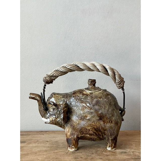 Unleash a whimsical touch upon your home with this truly unique vintage studio pottery teapot, masterfully crafted in the...