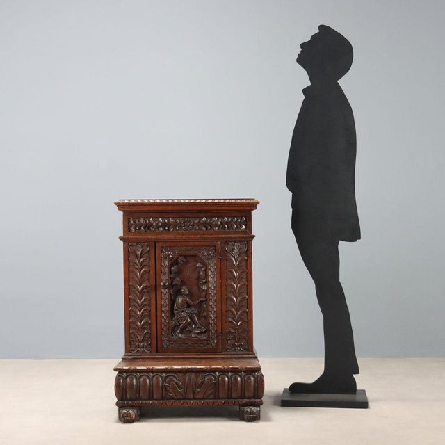 Genoese Baroque walnut kneeler. Drawer in the lower section, central door with carving of St. John the Baptist at the...