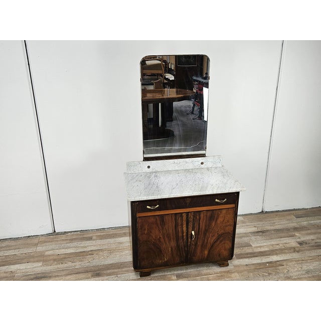 Art Deco walnut dressing table from the 1940s with a marble top and a large mirror on a marble base. It features a drawer...