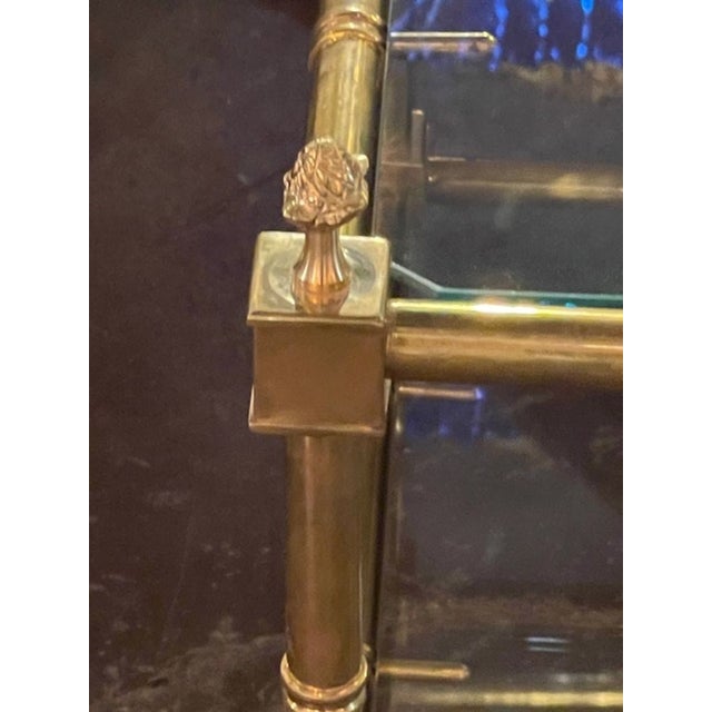 This Italian Gilt Brass Coffee Table is a luxurious and elegant piece of furniture. The gold color of the base adds a...