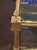 This Italian Gilt Brass Coffee Table is a luxurious and elegant piece of furniture. The gold color of the base adds a...