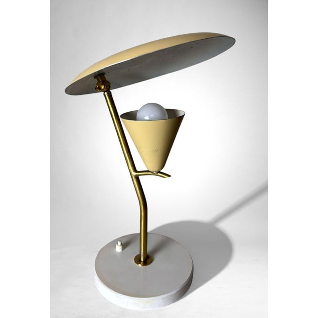 Elegant Italian table lamp from the late 1950s–early 1960s, crafted in enameled metal in soft pastel yellow and white...