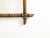 A French rectangular faux-bamboo walnut mirror from the early 20th century, with brown patina. Created in France during...