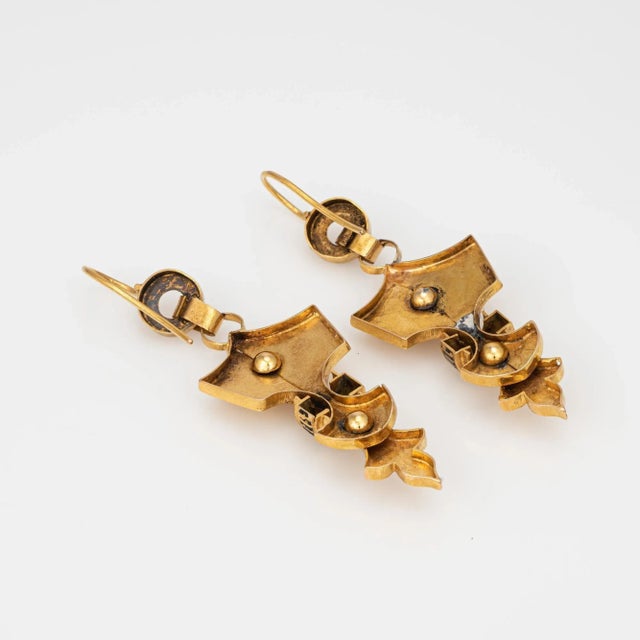 Elegant pair of antique Victorian Etruscan earrings (circa 1880s to 1900s) crafted in 18k yellow gold. The charming...