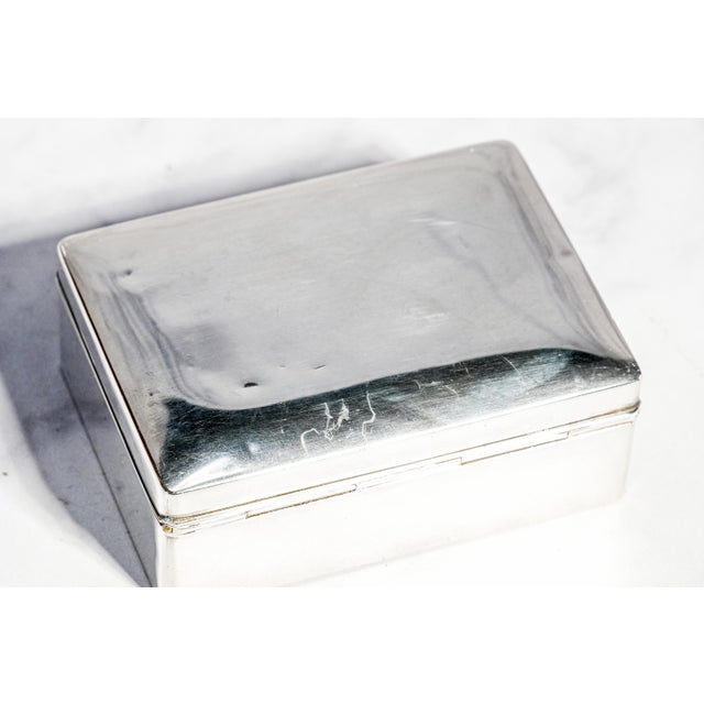Elegant in its restraint and beautifully refined in form, this circa 1915 sterling silver box embodies the understated...