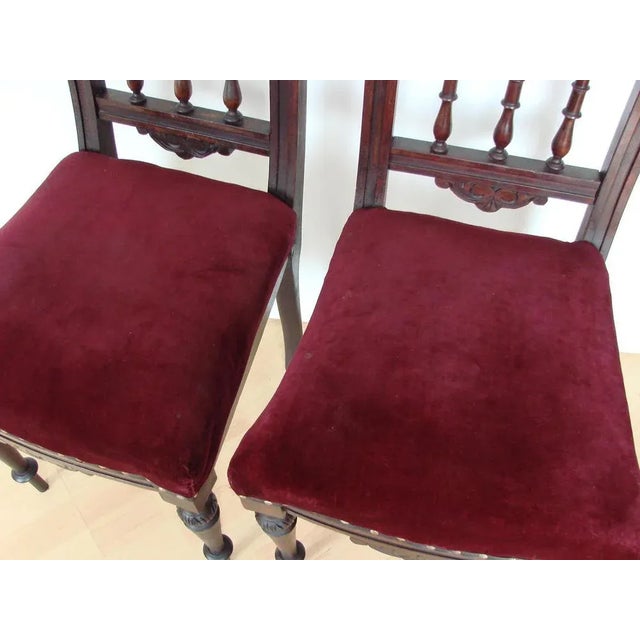 A pair of chairs from the 19th century, made of wood and velor fabric. The chairs are stable, in good condition....