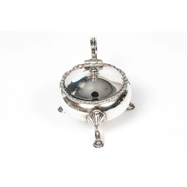 This beautiful ornate example of a mustard pot by famed Birmingham England silversmith Mappin and Webb was manufactured in...