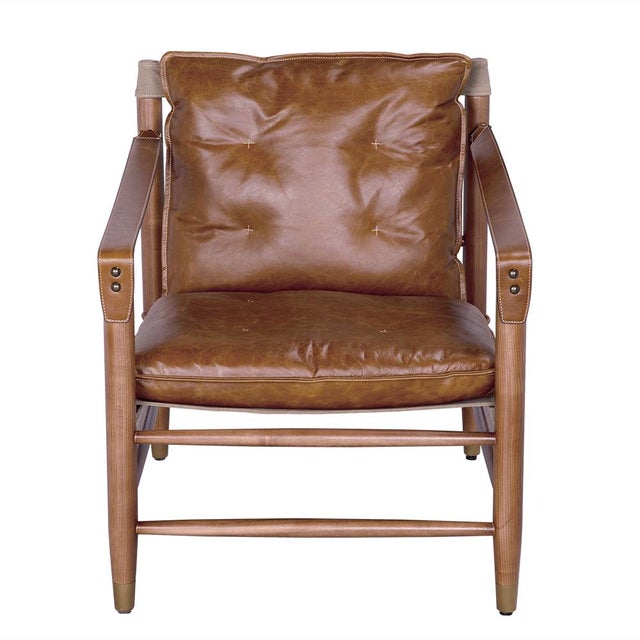 A refined blend of textures, the Luther Chair pairs warm Cuba Brown leather with durable canvas fabric, accented by brass...