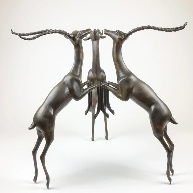 3 playful deer gather head to head forming a work of art or a unique table base. Simply add a piece of glass to the deer’s...