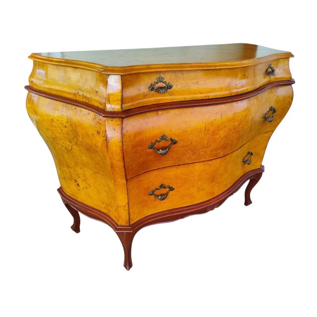 Add a striking focal point to your entryway, hallway, or bedroom with this vintage Italian Rococo-style bombe commode....
