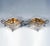 Pair of delicate diamond-shaped silver vessels on four rocaille feet, vertical walls chiselled and decorated with...
