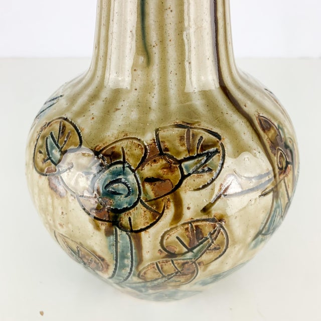 Beautiful vintage mid century modern pottery vase with drippy glaze and carved flowers and abstract scene. Love the colors...
