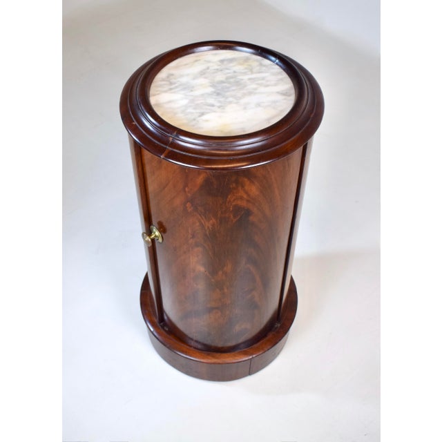 An English Empire 19th Century column bedside table with distinctive cylindrical form of "Somno" (Latin for sleep) styling...