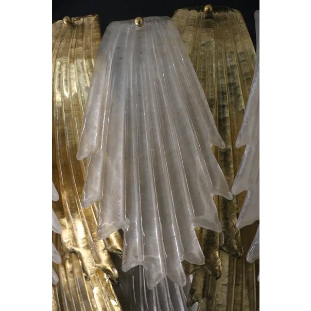 This spectacular pair of wall lights was entirely handcrafted in Murano. Each single leaf was individually made in high...