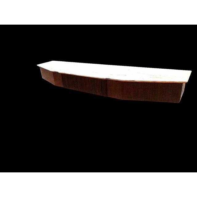 Beautiful wall console table attributed to Osvaldo Borsani and produced by his Atelier Arredamenti Borsani in Varedo. The...