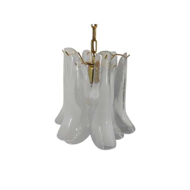 The "Petali" suspension lamp is composed of blown glass elements called "Petali" due to the shape that recalls the petal...