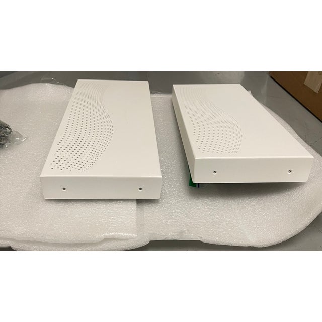 A progressive array of gradient pinholes in a variety of patterns permits illumination to penetrate the surface of the...