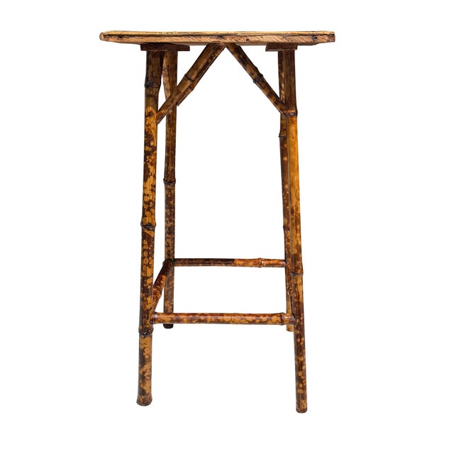 A wonderfully atmospheric antique bamboo plant stand or tall occasional table dating to approximately 1890–1910. Its...