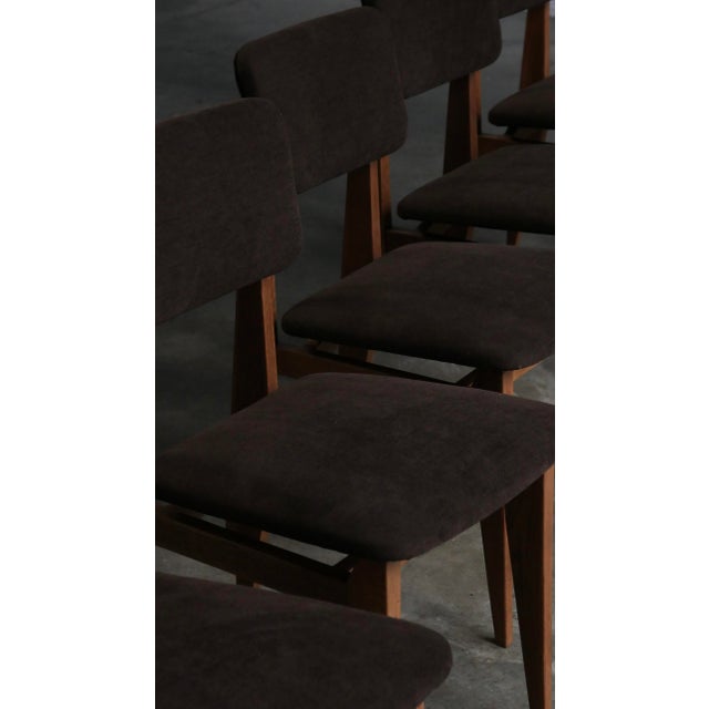 This set of six ca model chairs by marcel gascoin, produced by arhec in the late 1940s, perfectly illustrates the spirit...