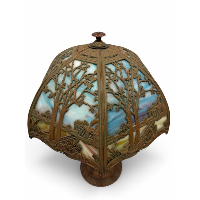 Illuminate your home with a museum-quality piece of American history. This breathtaking early 20th-century slag glass...