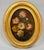 Pair of oval floral still lifes from the mid-19th century, on canvas mounted on panel, in beautiful gilt frames. A...