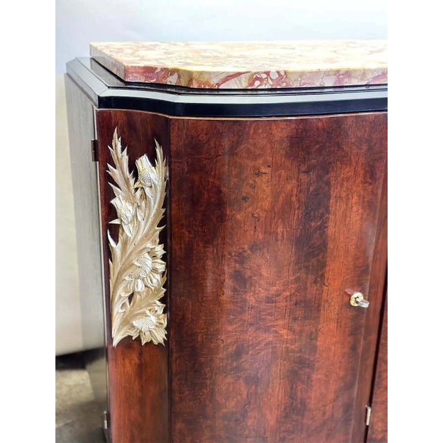 The French Art Deco wood credenza from the 1920's is an exquisite piece of furniture that embodies the elegance and...