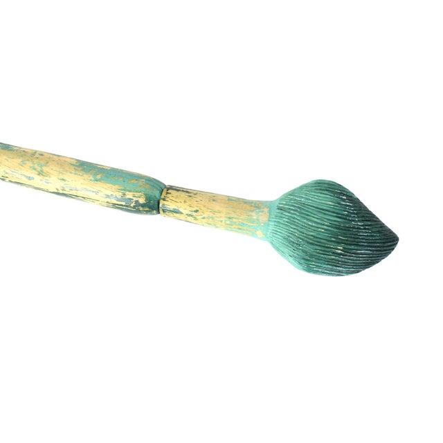 Bright handmade wood sculpture of a paintbrush. Well made with tapered handle, detailed brush thistles, and paint...