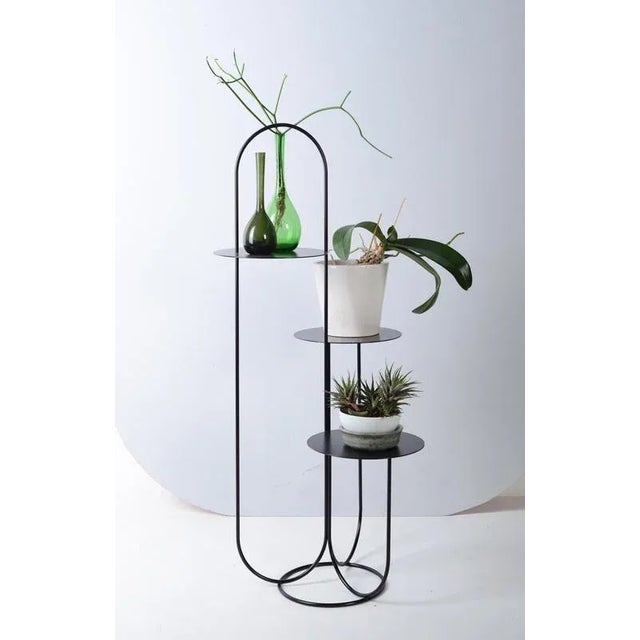 Black trumpet table by ok design dimensions: d 45 x w 47 x h 105 cm. Materials: powder-coated metal.