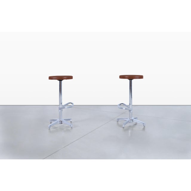 Introducing this stunning pair of mid-century barstools, crafted in the United States circa the 1970s. These barstools...