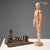 Bronze inkwell with a sculpture of a young Dutch girl walking with geese. A stump-shaped cruet holder. Glass cruet. This...