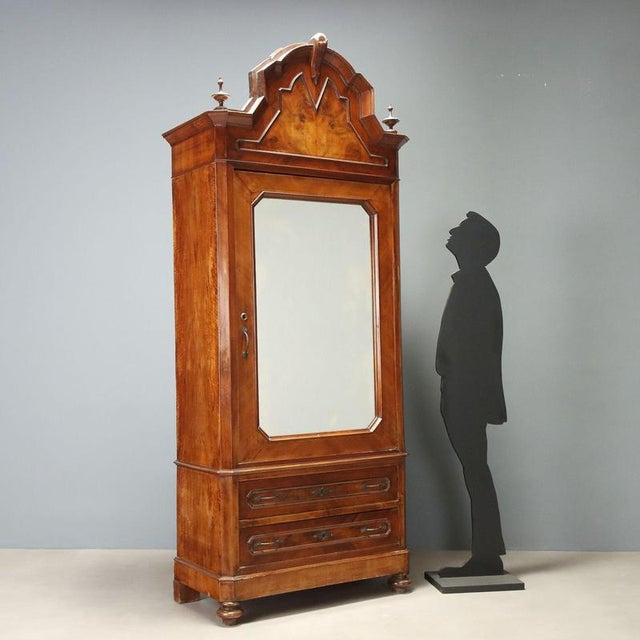 Umbertino walnut wardrobe made in Italy at the end of the 19th century. The structure is characterized by elegant...
