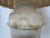 Elegant sculptural pair of urn shaped alabaster table lamps having pretty wreath decoration around the periphery and silk...