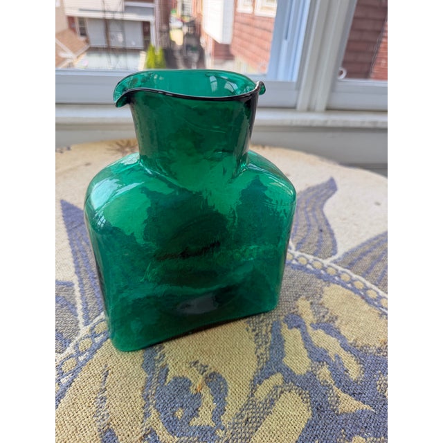 Emerald green Blenko glass decanter. The item still has the sticker on the bottom.