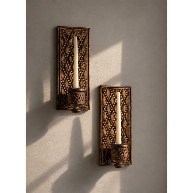 Pair of french brutalist wall sconces, circa 1970s, crafted in solid oak with carved geometric decoration and removable...