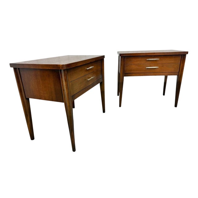 Add timeless Mid-Century Modern style to your bedroom with this beautiful pair of Broyhill Saga walnut nightstands....