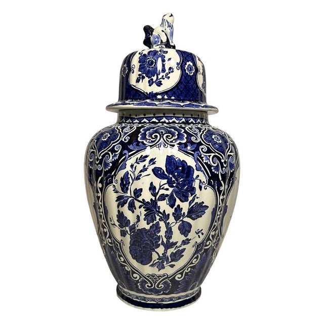 A large three-piece Delft blue garniture set by Royal Sphinx by Boch, Holland, dating from the mid-20th century. The set...