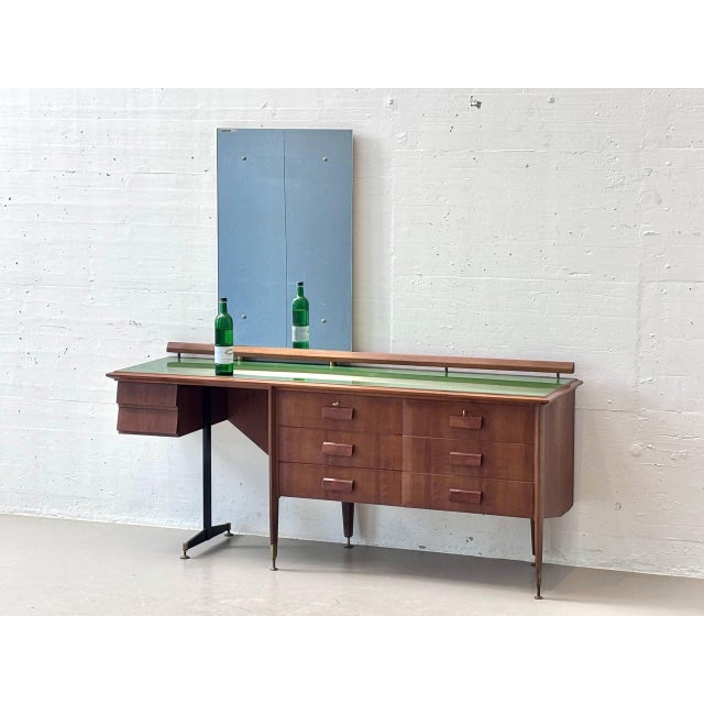 An elegant italian mid-century sideboard from the 1960s, boasting exceptional design and high-quality craftsmanship. The...