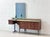 An elegant italian mid-century sideboard from the 1960s, boasting exceptional design and high-quality craftsmanship. The...