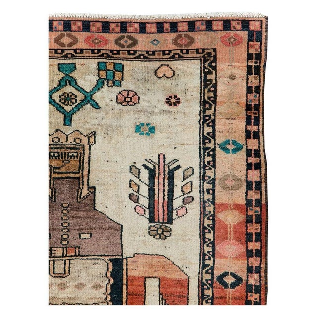 A vintage Persian pictorial Bakhtiari gallery format accent carpet handmade during the mid-20th century. Measures: 4' 11"...