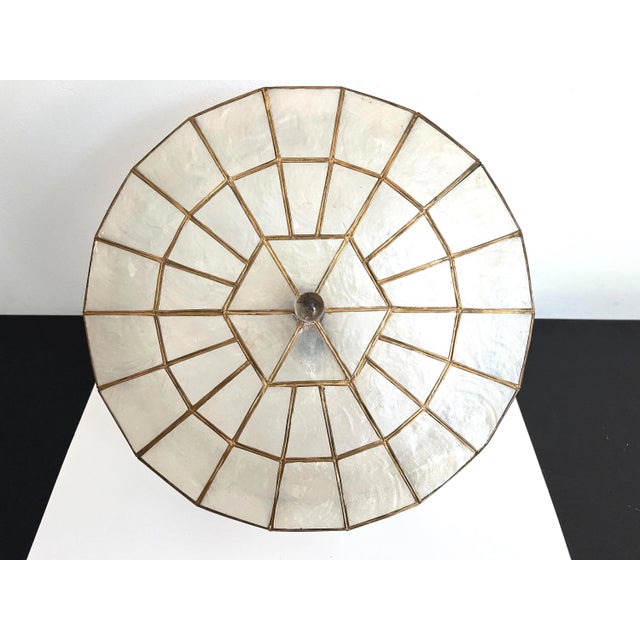 Lovely large mid century capiz shell flush mount ceiling light imported from the Philippines in a chic round wheel form...