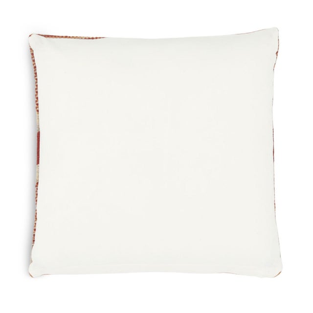 Hand woven wool striped and patterned pillow in warm red / orange tones. Modern southwestern inspired design. Back is...