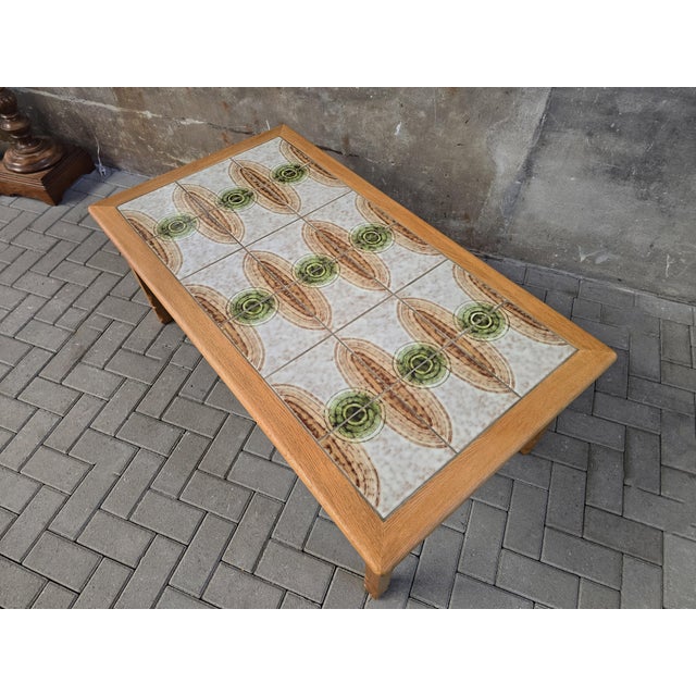 This stunning table has been designed and made during the 1970's in Denmark. This four-legged table is made of oak with a...