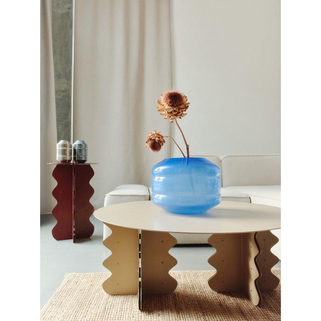 The "Hvylya" contemporary coffee table is a stunning fusion of sculptural art and functional design, where flowing waves...