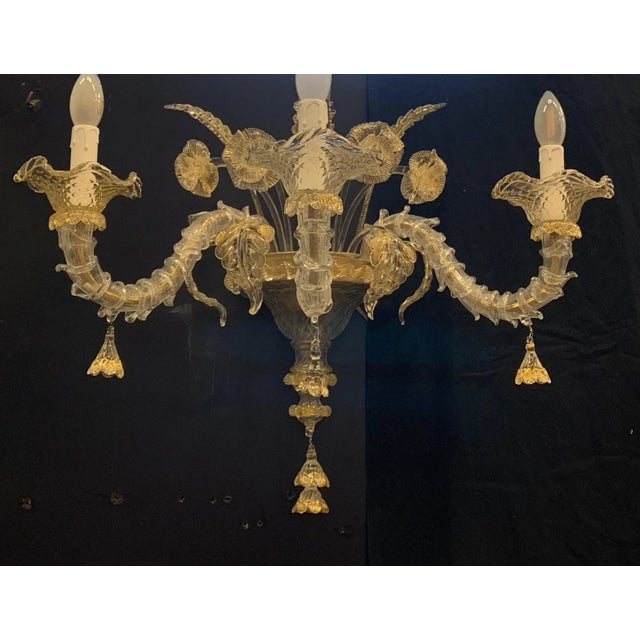 Single wall sconce with many Murano details. The glass is made in Murano. Attributed to Seguso. Iron frame. The glass...